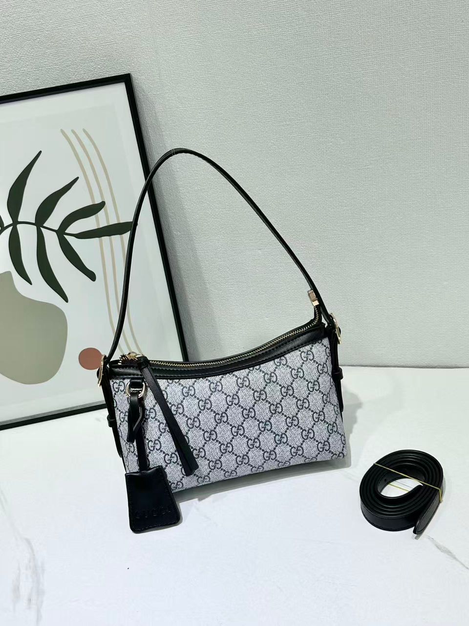 Grey Gucci monogram crossbody bag with black trim