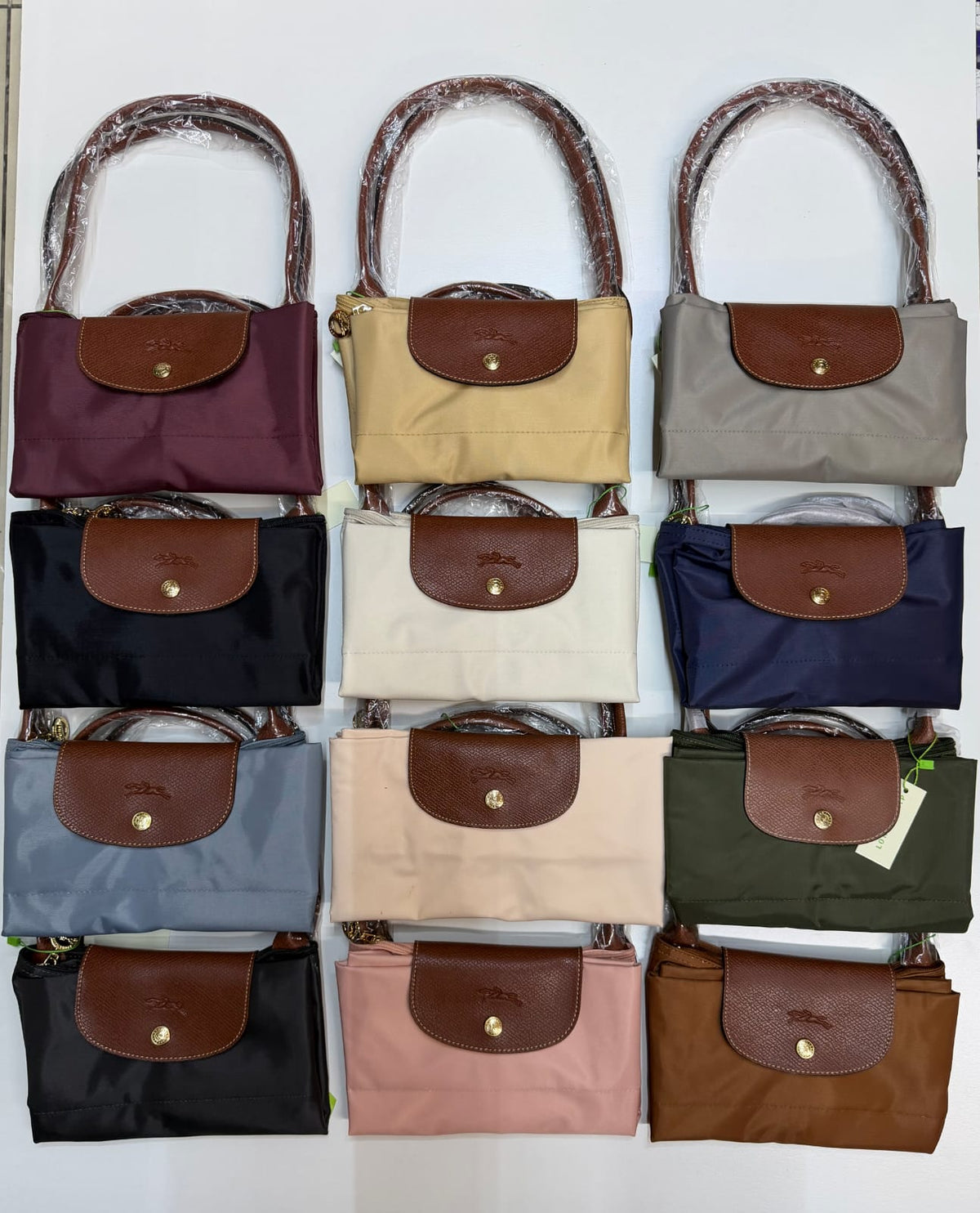 Longchamp women’s tote bags in multiple colour options