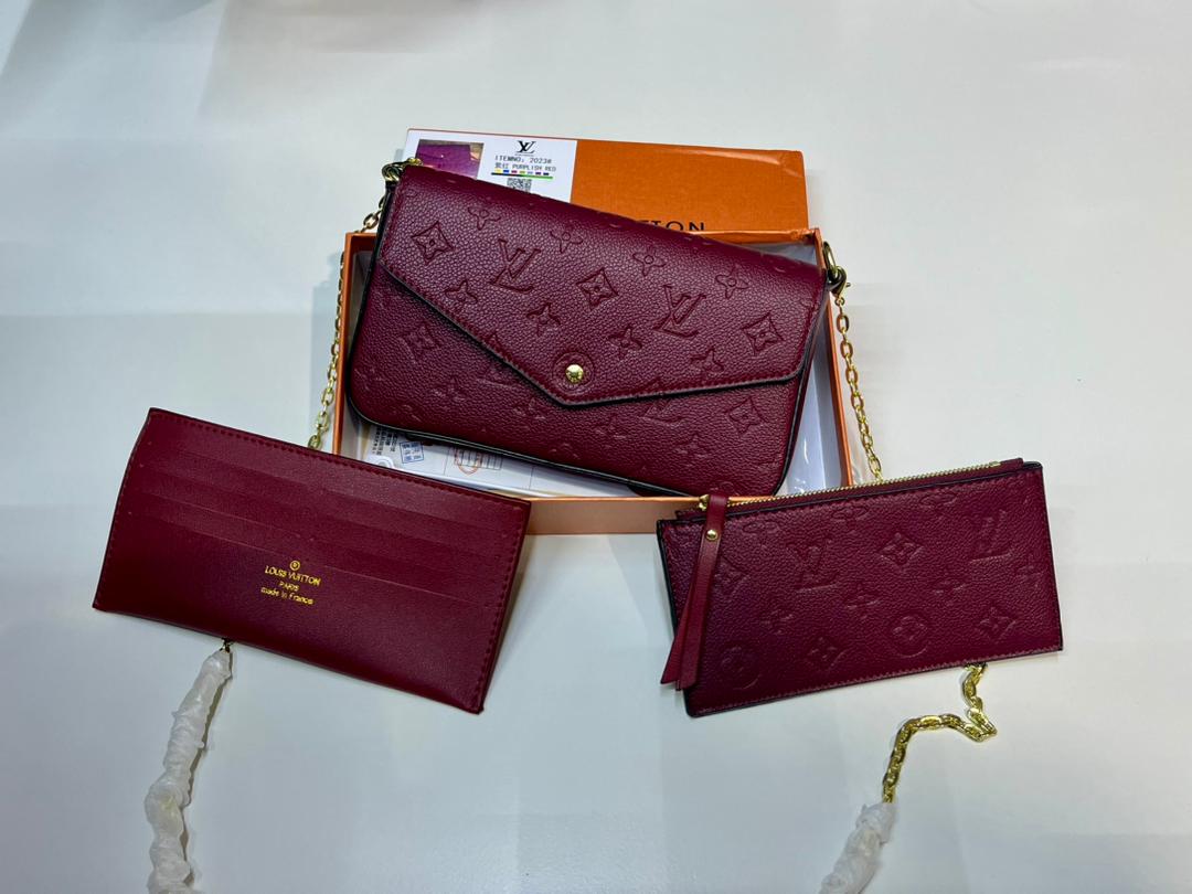 Burgundy Louis Vuitton-style chain bag shown on shoulder