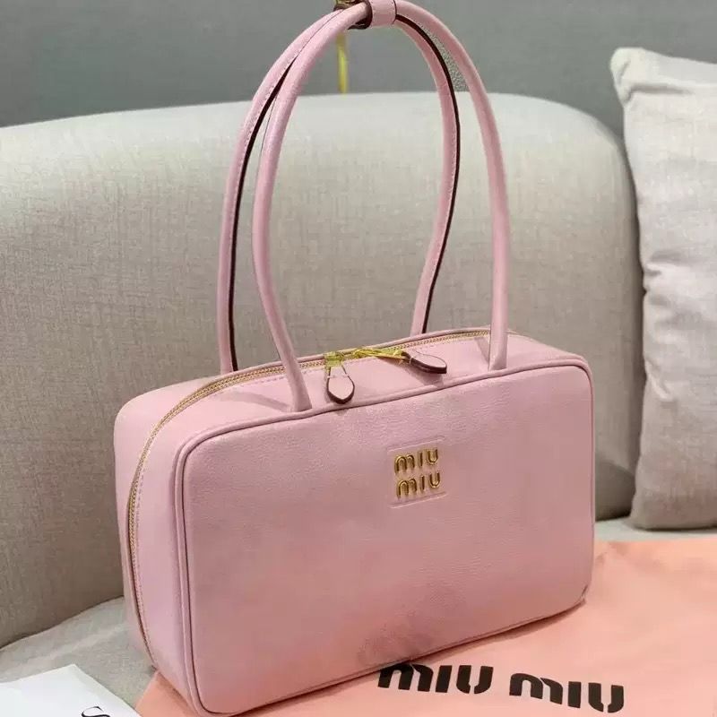 Soft pastel pink Miu Miu leather top handle handbag