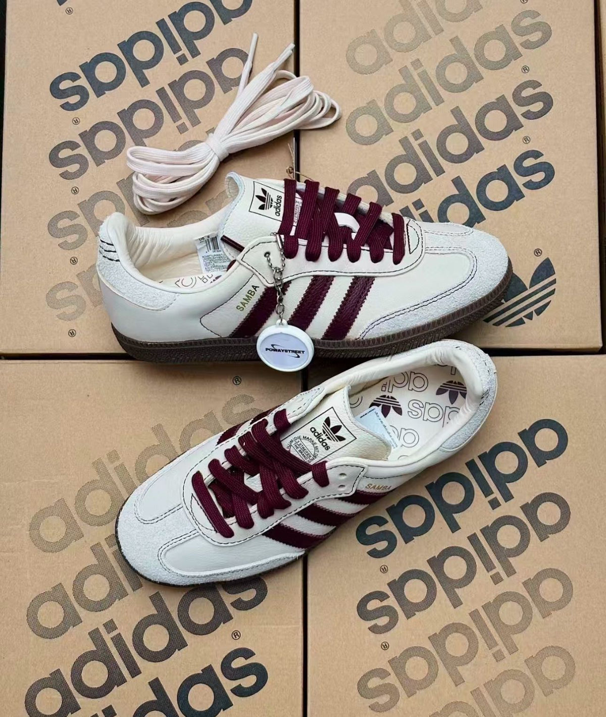 Pair of cream and burgundy Adidas Samba shoes