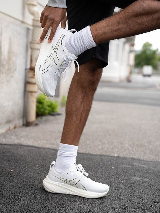 White ASICS GEL-KAYANO 32 shoes shown on foot