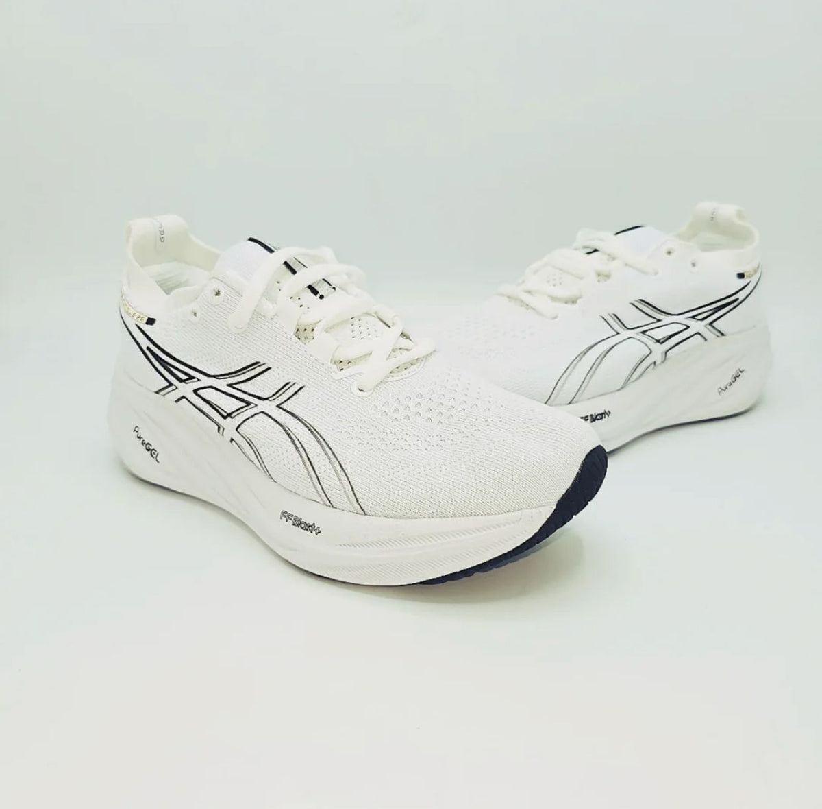 Pair of ASICS GEL-KAYANO 32 white running shoes