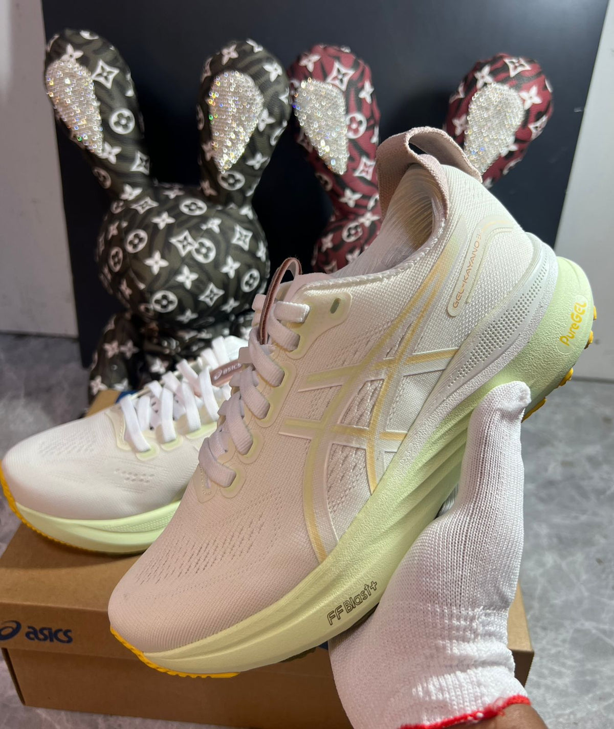 ASICS GEL-KAYANO cream and yellow sneakers at Meya Luxury Brand