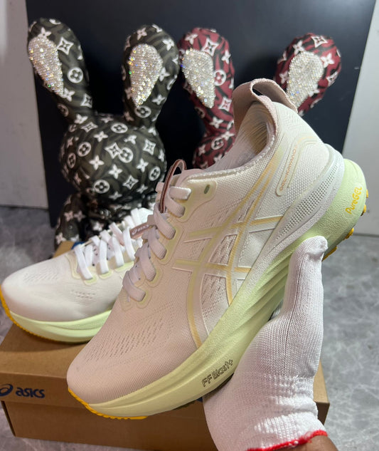 ASICS GEL-KAYANO cream and yellow sneakers at Meya Luxury Brand