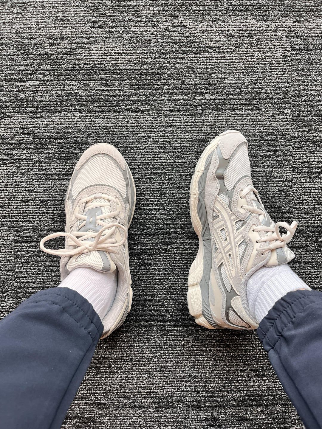 Top view of ASICS GEL-NYC cream and grey shoes