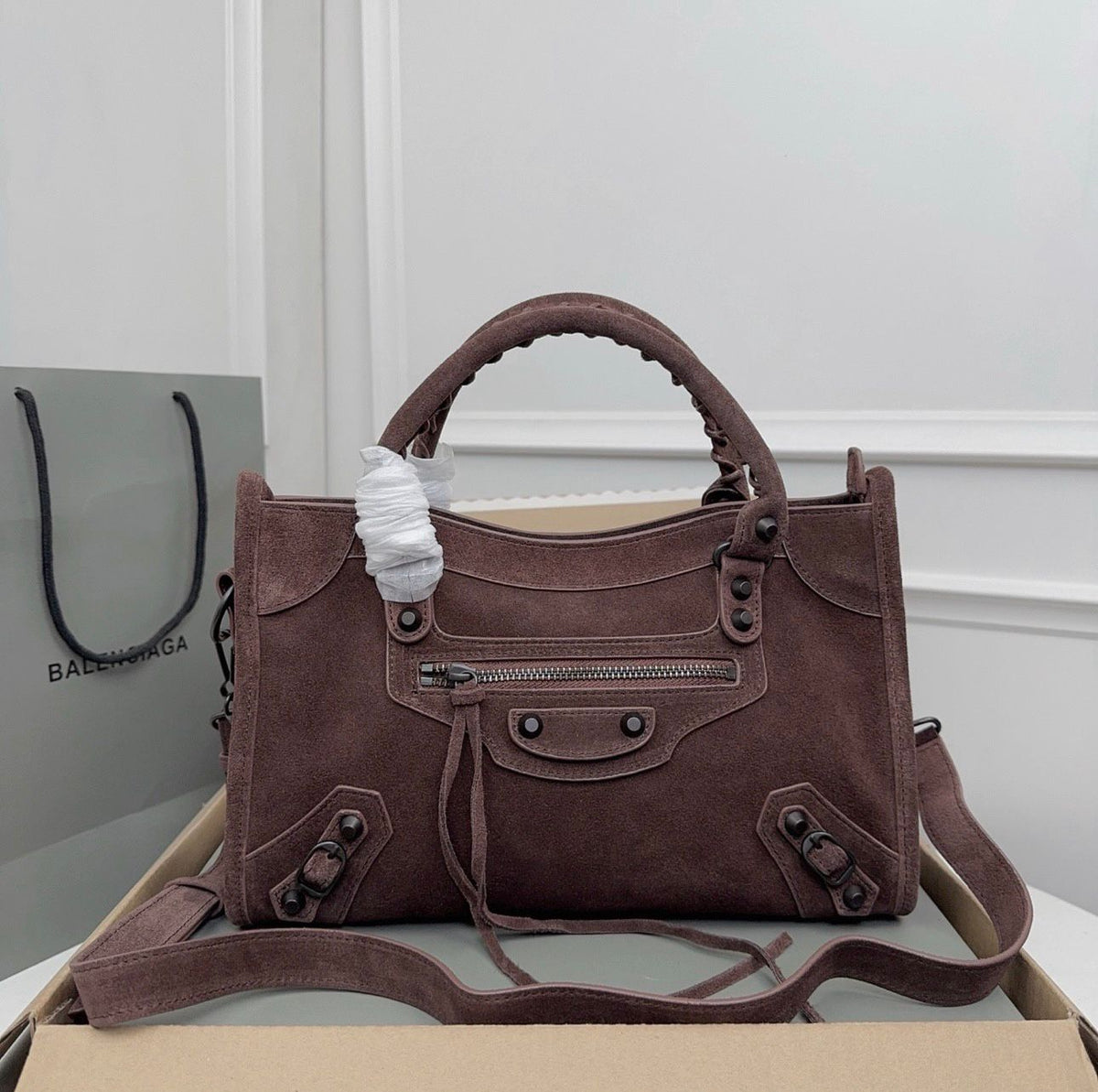Burgundy Balenciaga city leather bag with front zipper pocket and tassels