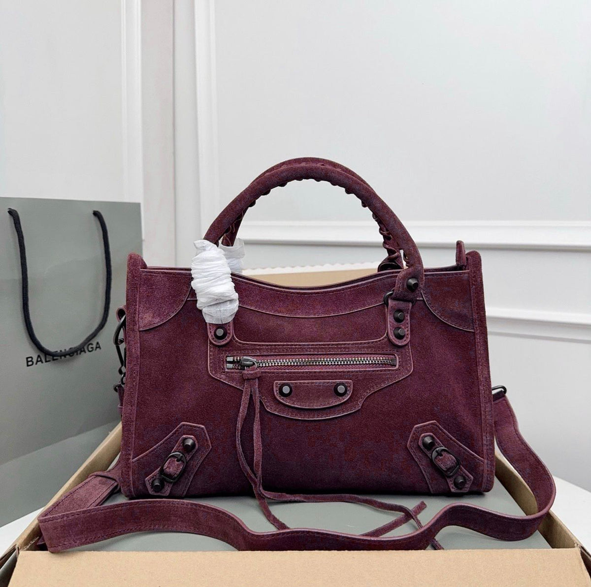Deep burgundy red Balenciaga city leather bag with stud hardware