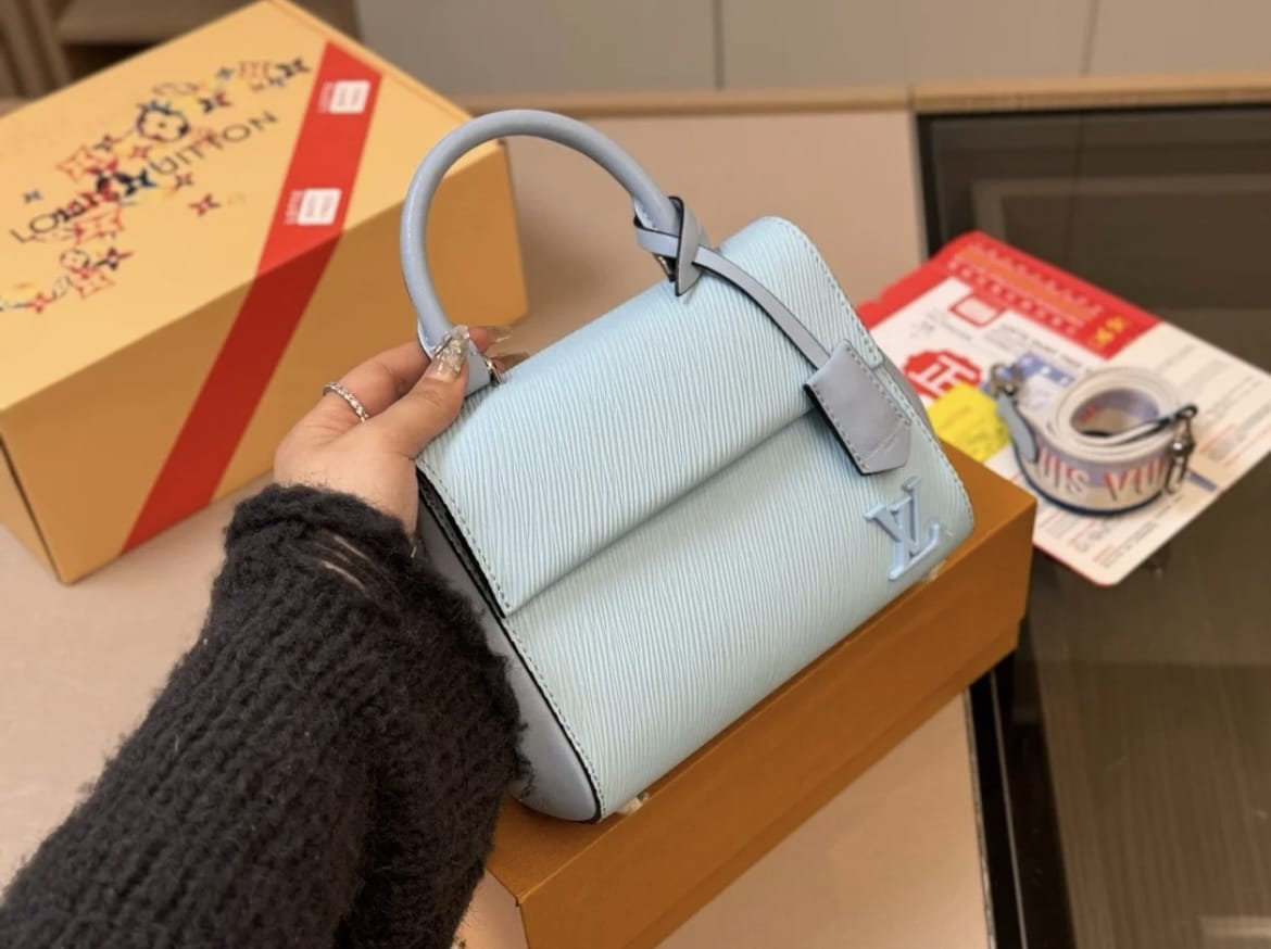 Blue structured women’s handbag with top handle