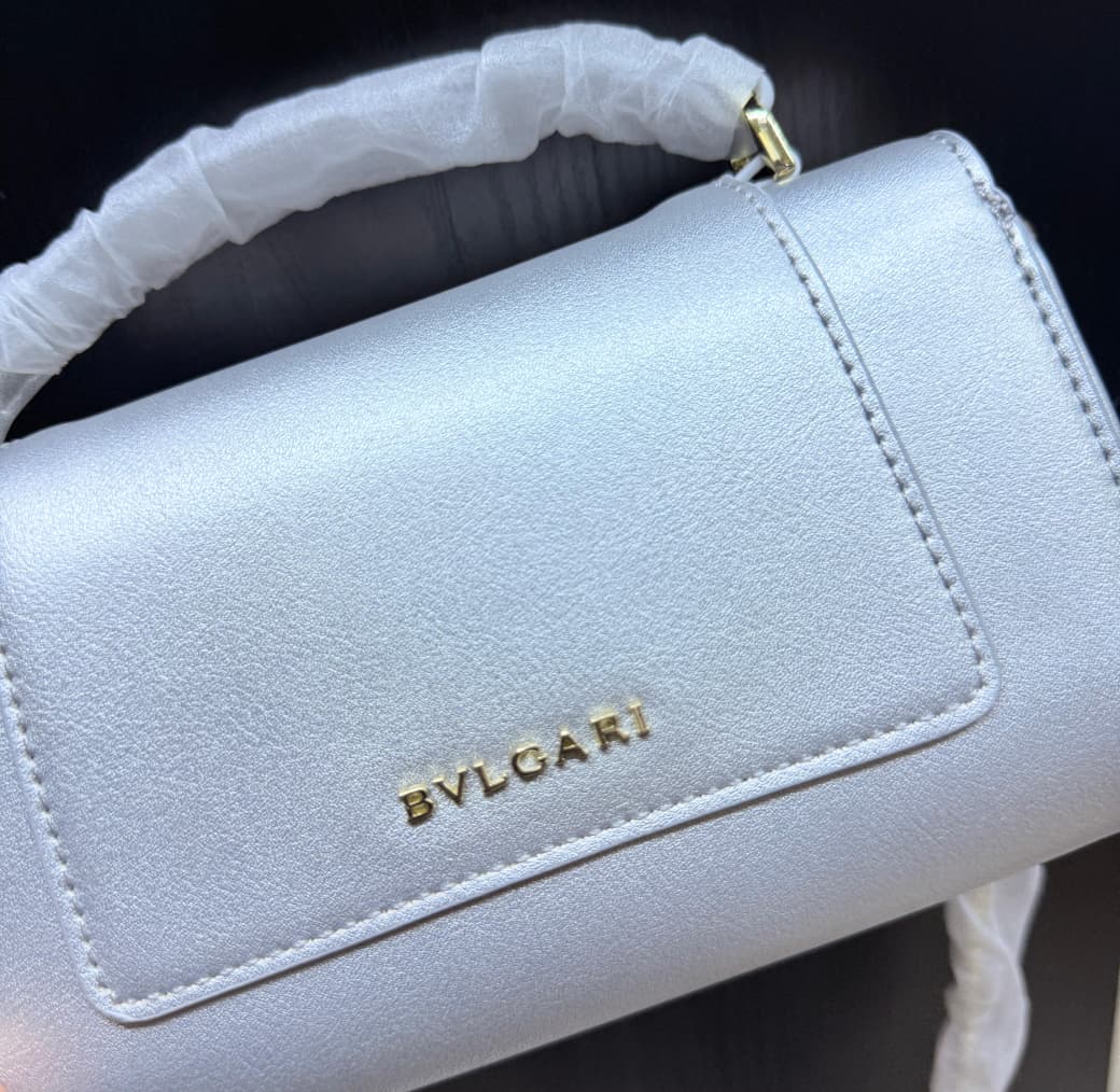 Close-up of silver BVLGARI women’s mini handbag