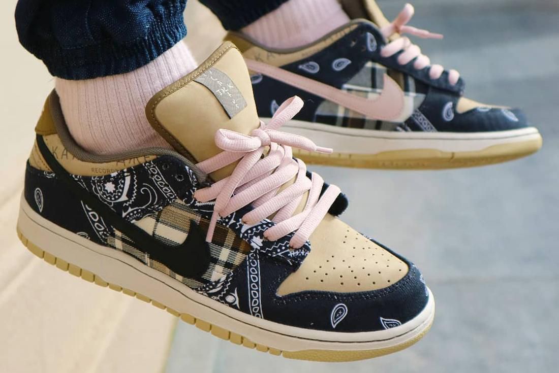 Cactus Jack Nike SB Dunk Low sneakers shown on foot