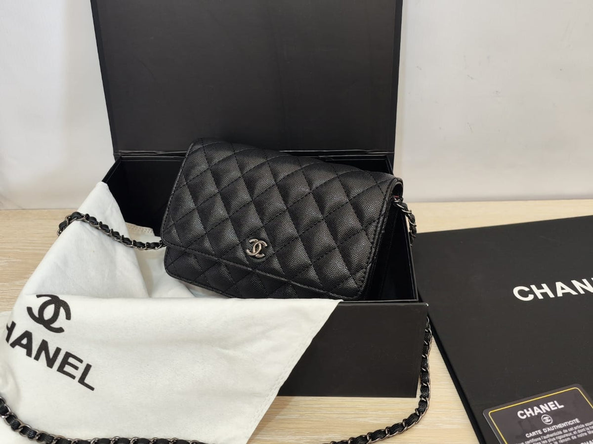 Black Chanel quilted bag with gold-tone chain strap