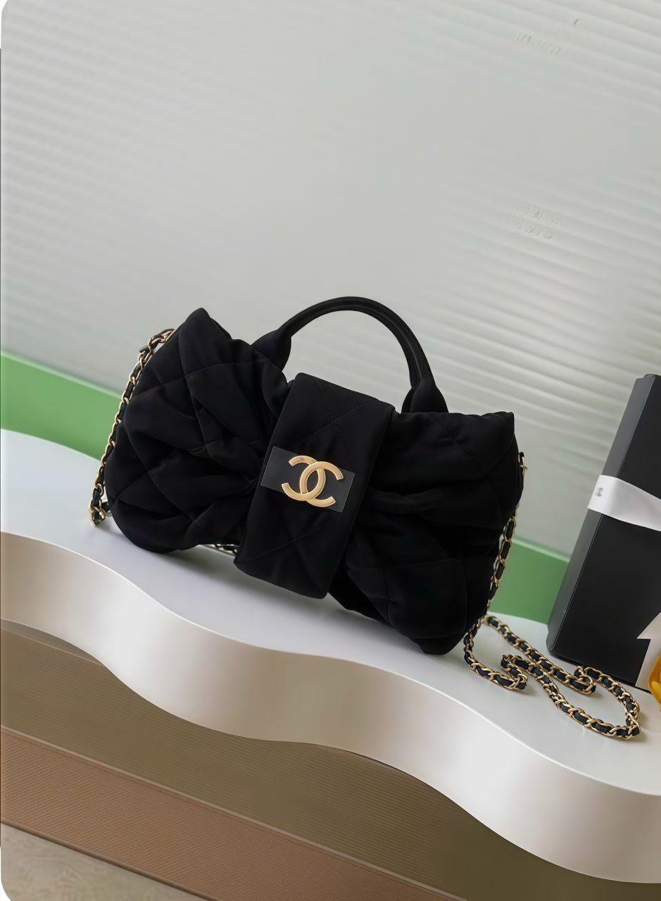 Black Chanel quilted bag with double top handles