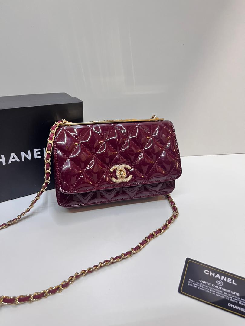Burgundy patterned Chanel mini bag with chain strap