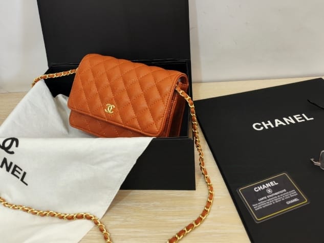 Orange Chanel quilted wallet-on-chain bag