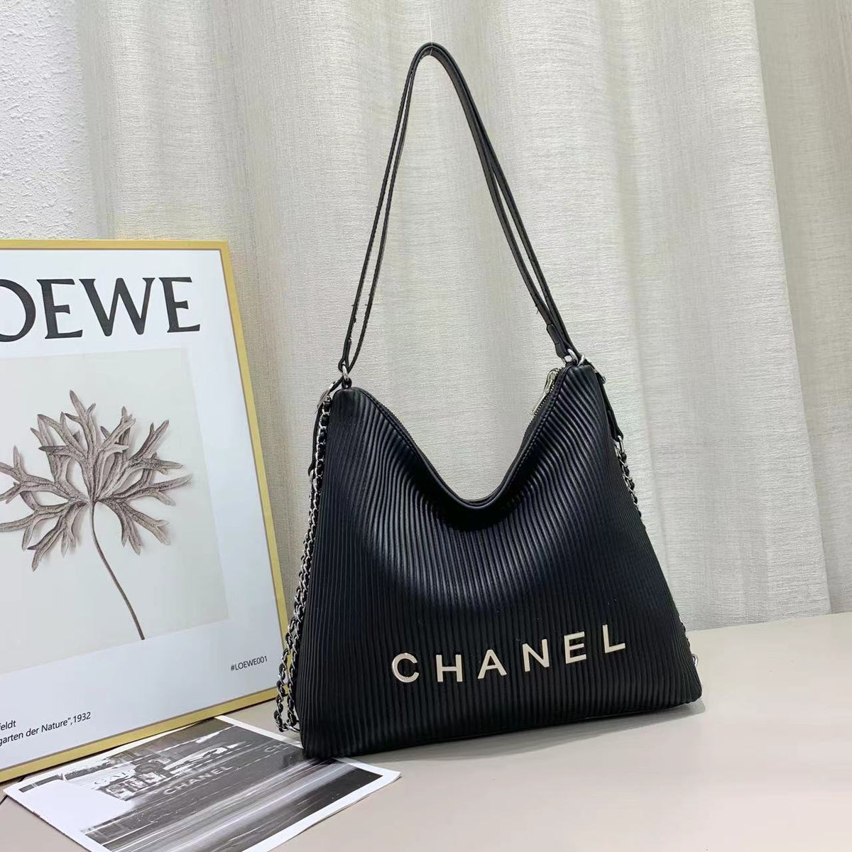 Black Chanel shoulder bag with front logo detail