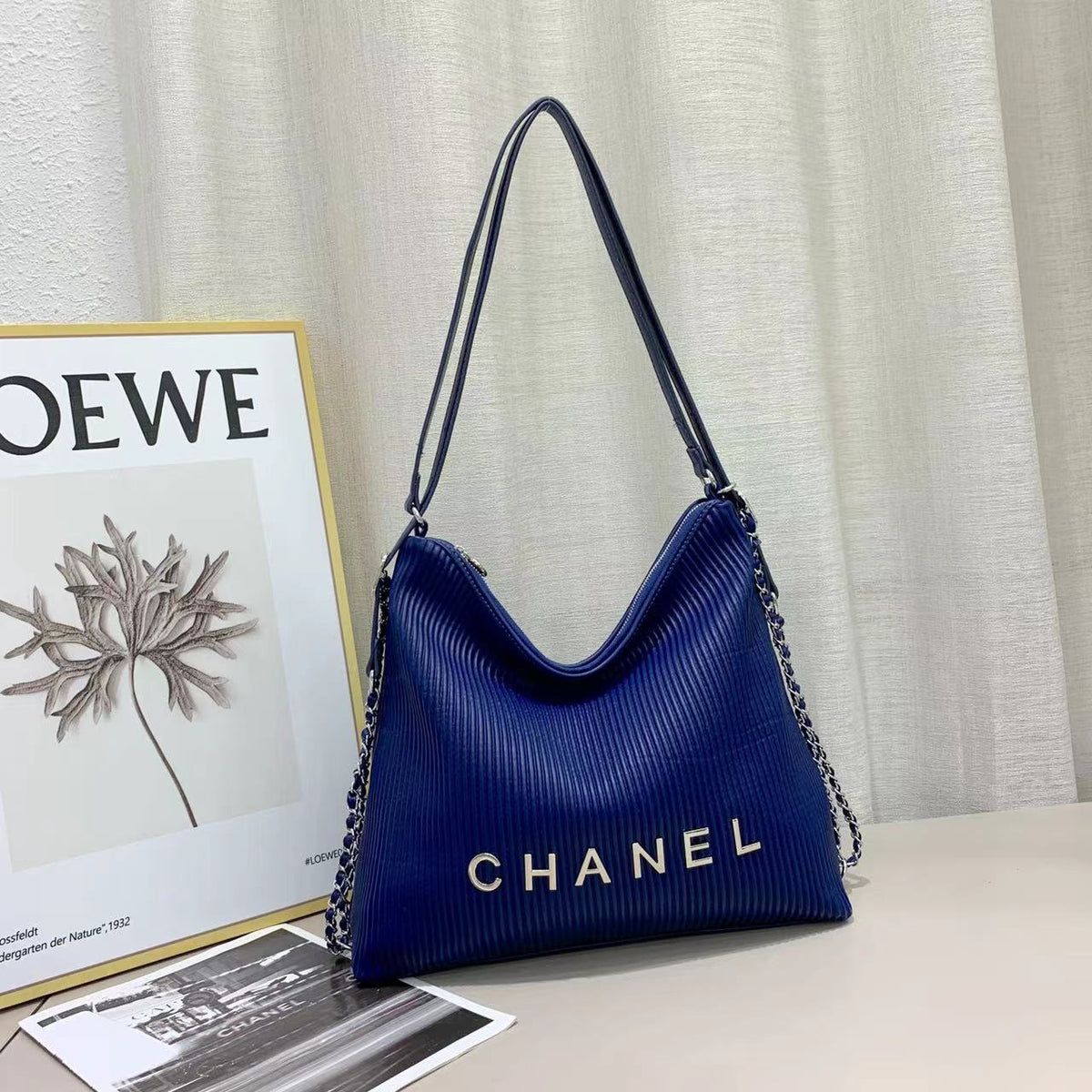 Blue Chanel shoulder handbag with long strap