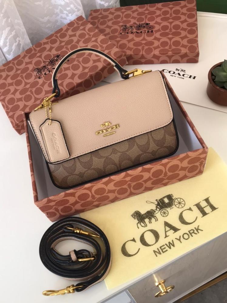 Beige Coach structured crossbody bag with shoulder strap