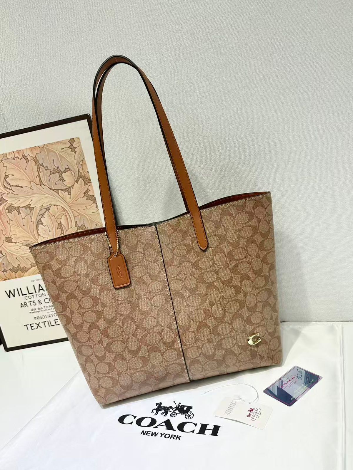 Cognac tan Coach signature canvas tote bag with leather straps