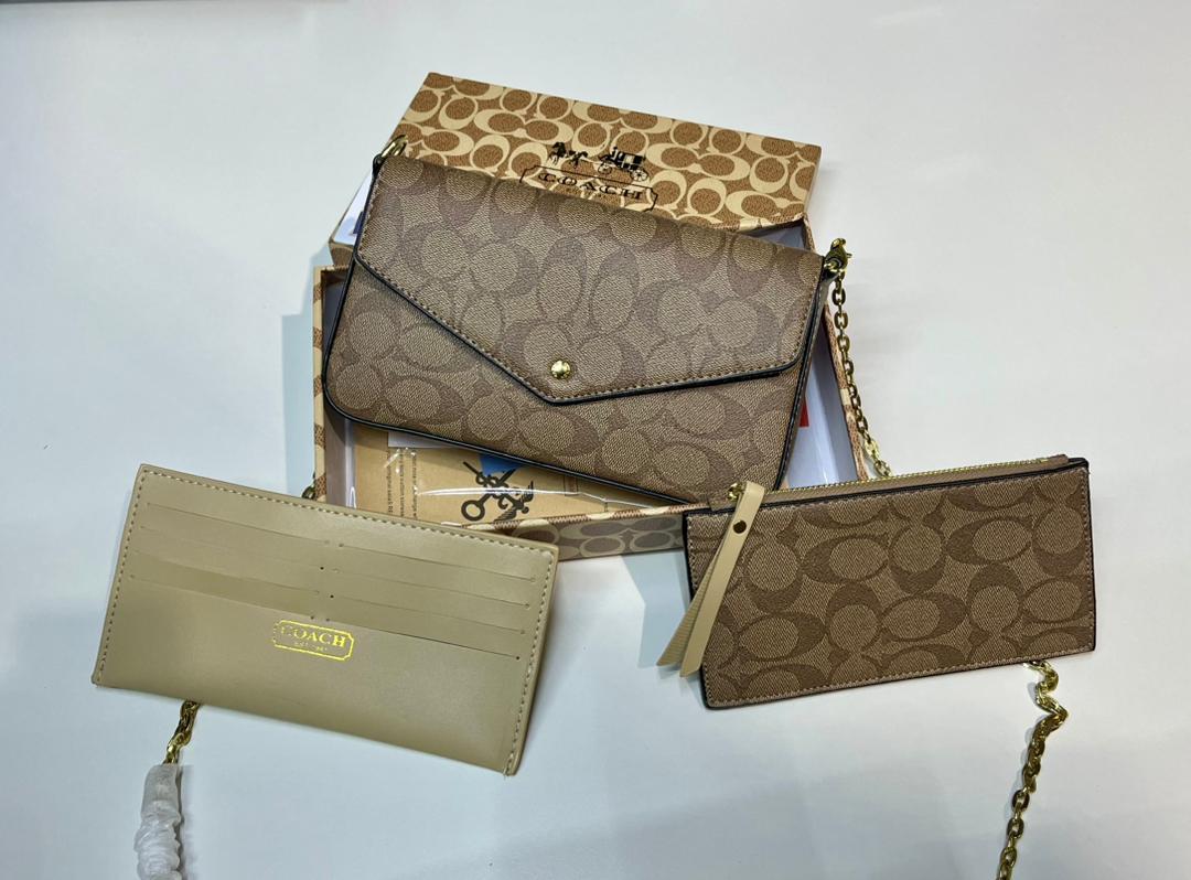 Beige Coach crossbody bag with matching accessories