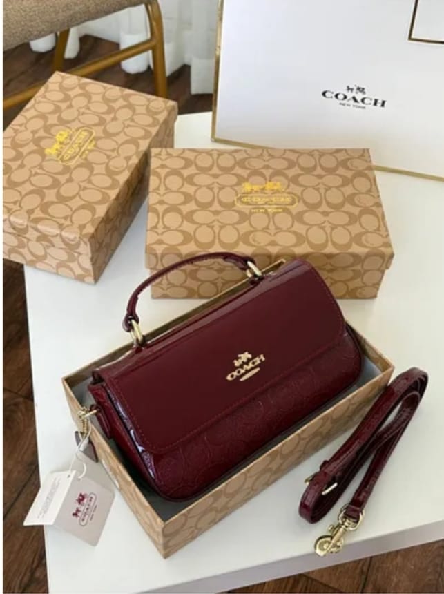 Beige and burgundy Coach women’s crossbody bags