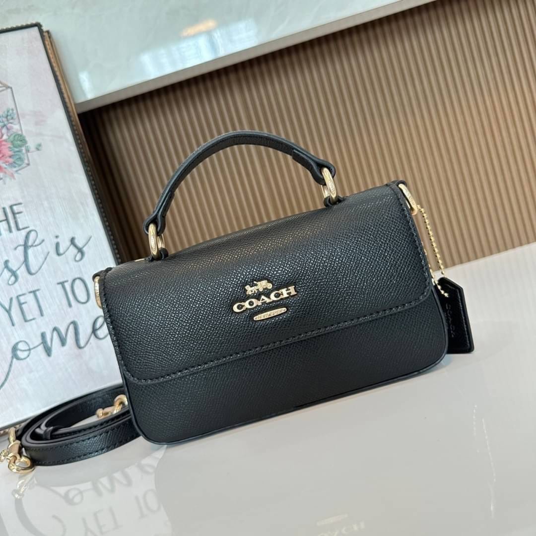 Green Coach structured crossbody bag with top handle