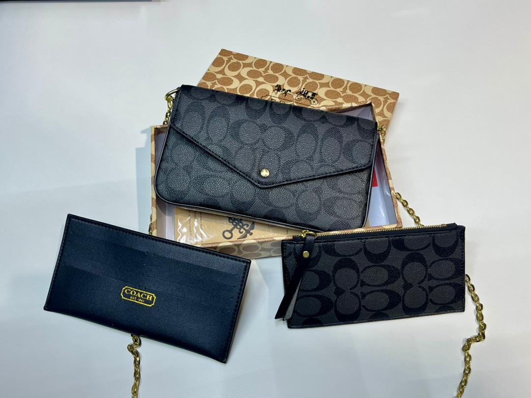 Coach women’s crossbody bag displayed with matching accessories in UAE