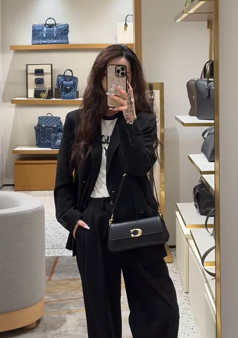 Coach women's shoulder bag styled for women at Meya Luxury Brand