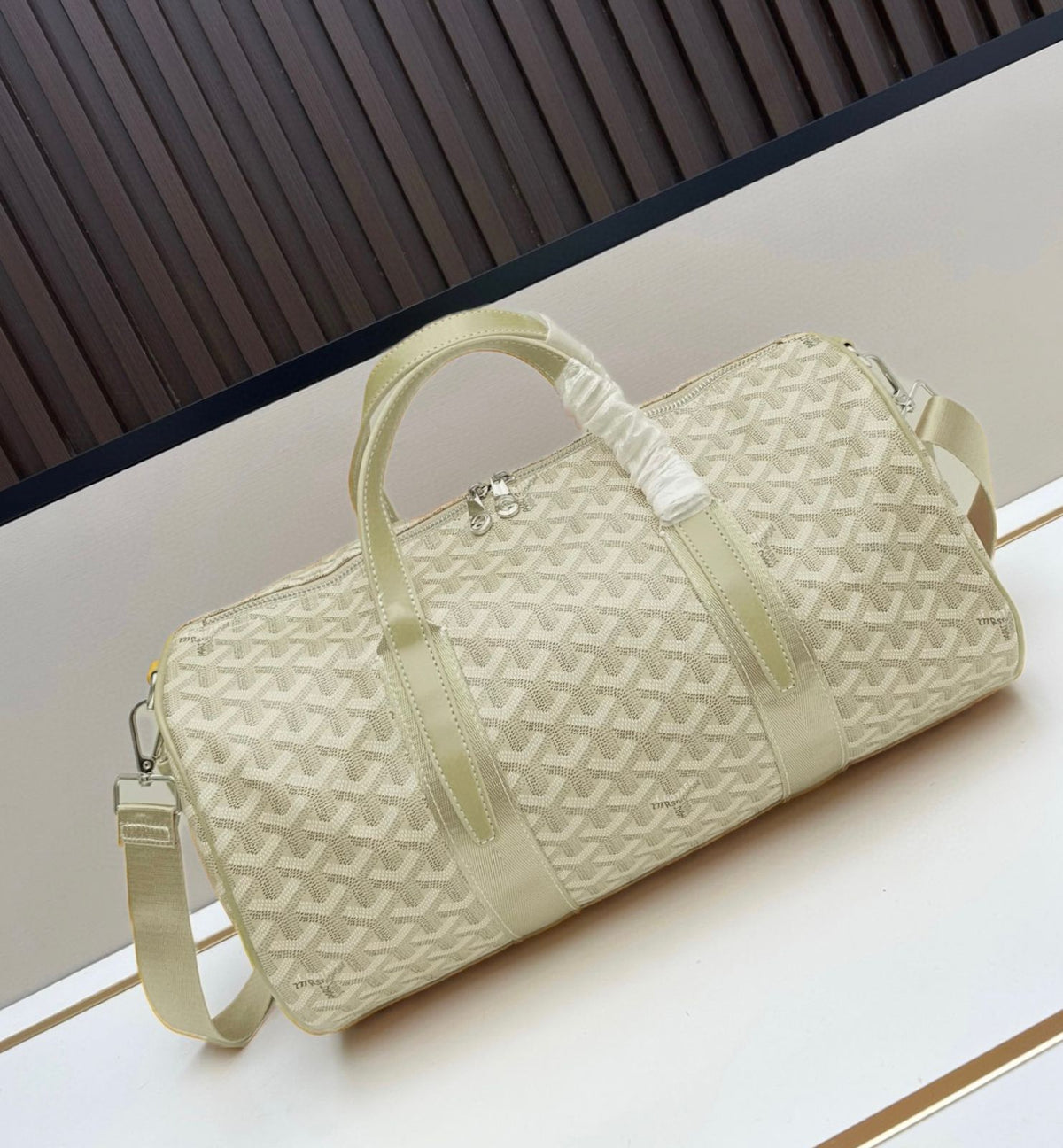 Cream white Goyard Goyardine canvas cylinder duffel bag with shoulder strap