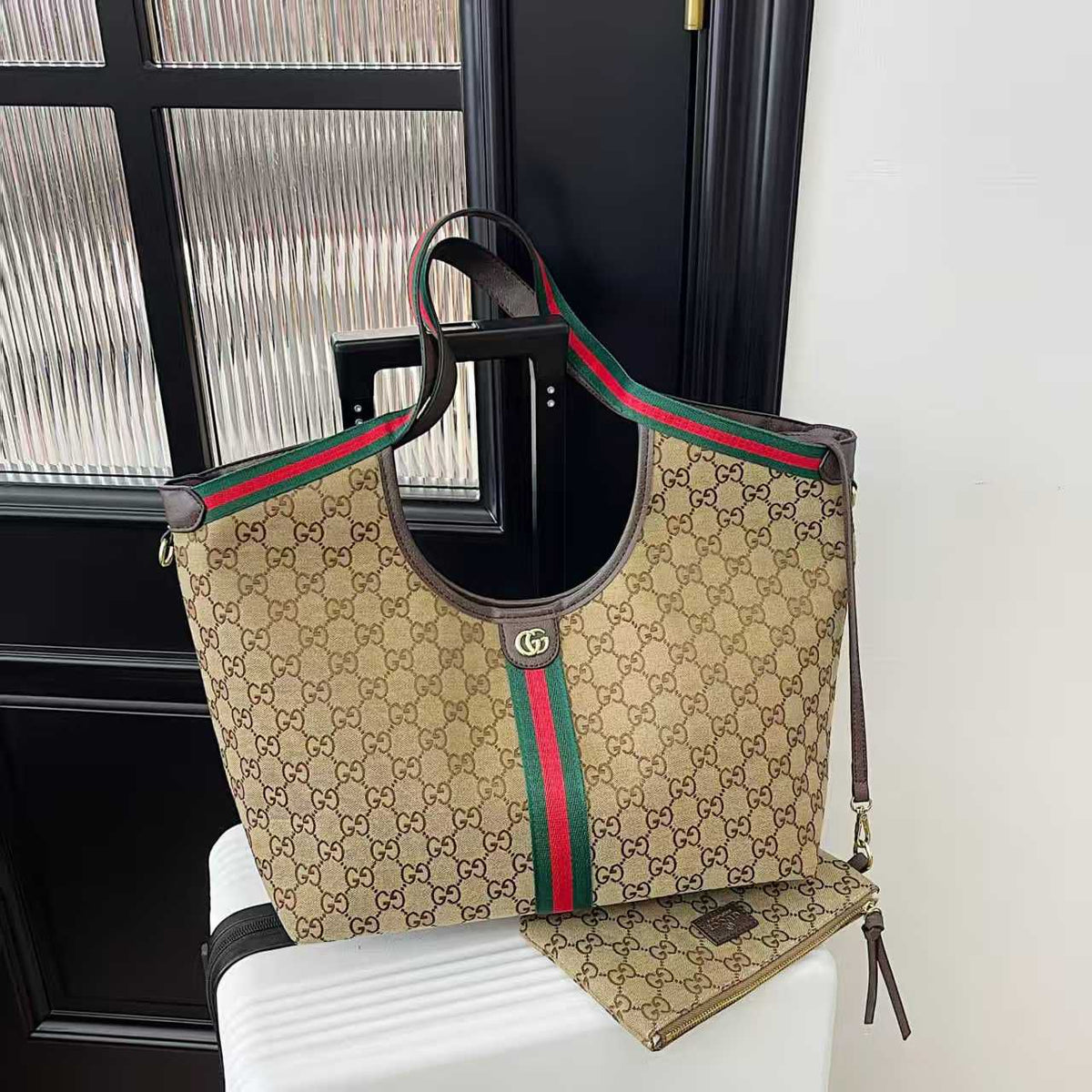 Front view of beige Gucci women’s tote bag