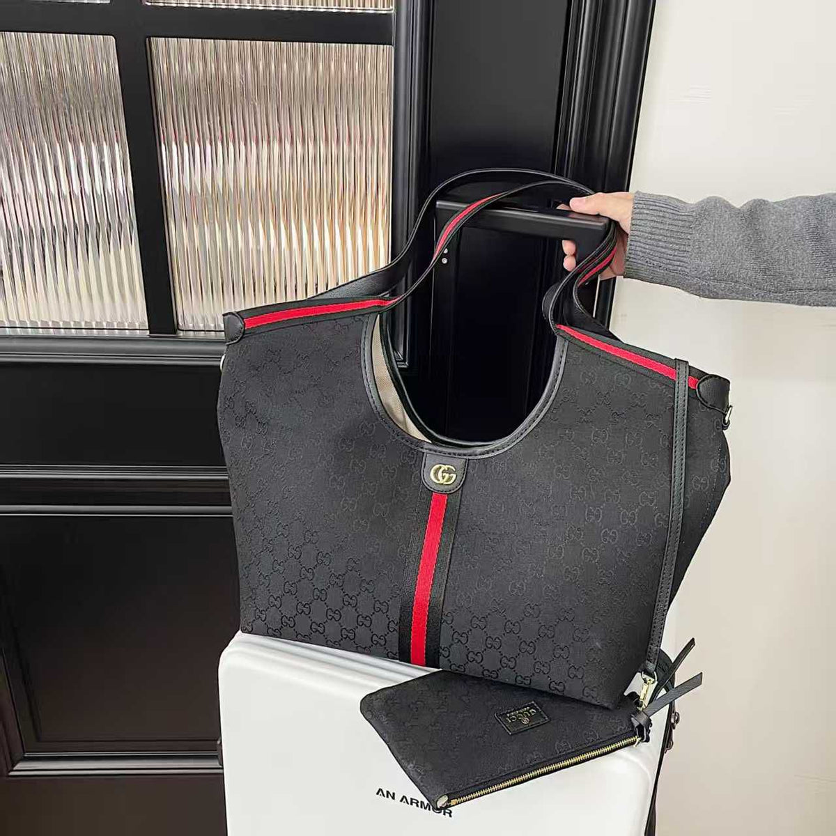 Black Gucci monogram tote bag with contrasting stripe