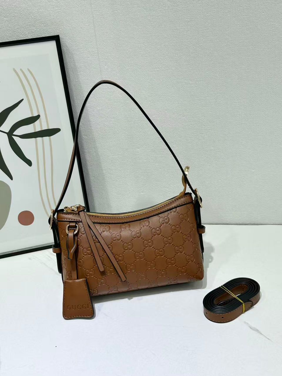 Brown Gucci women’s crossbody bag with shoulder strap