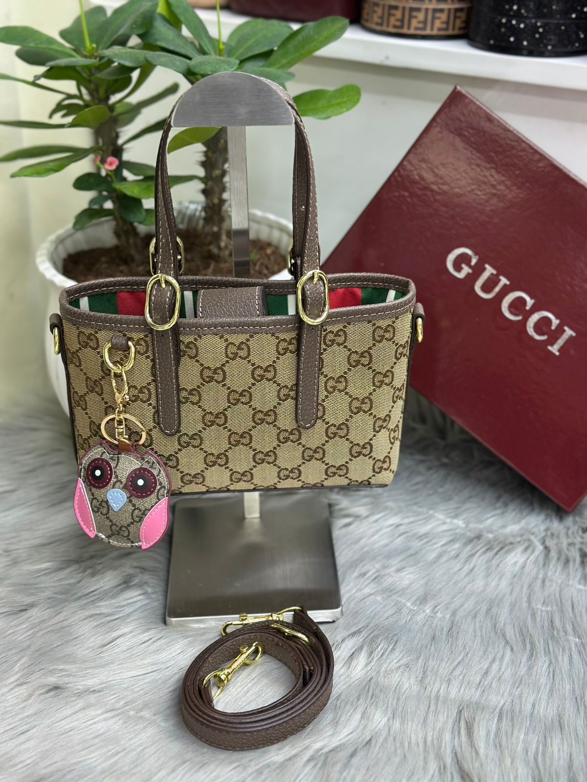 Beige brown Gucci GG canvas top handle tote bag with brown leather trim
