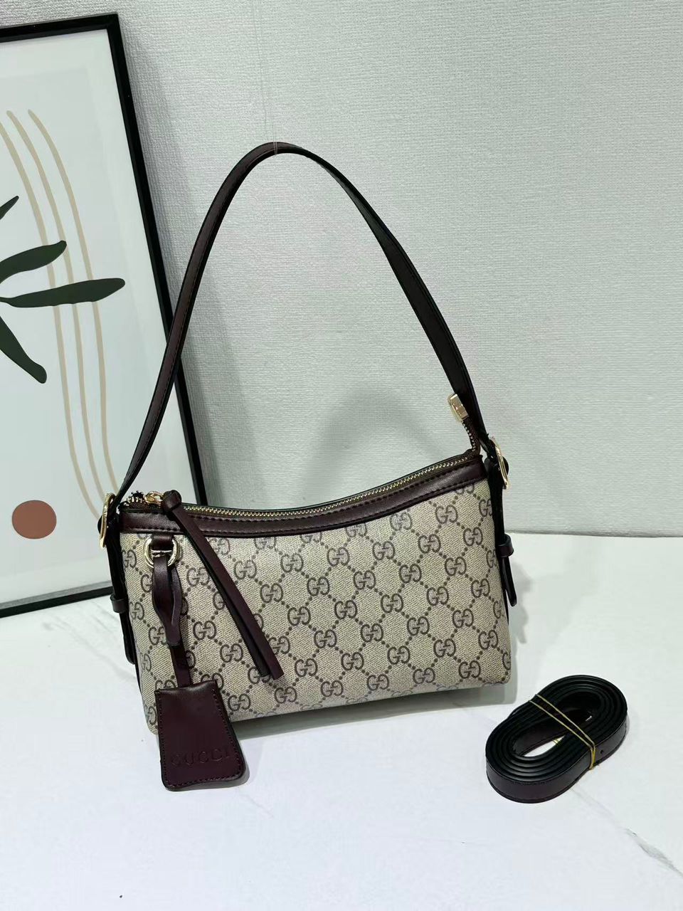Gucci monogram women’s crossbody bag with dark trim