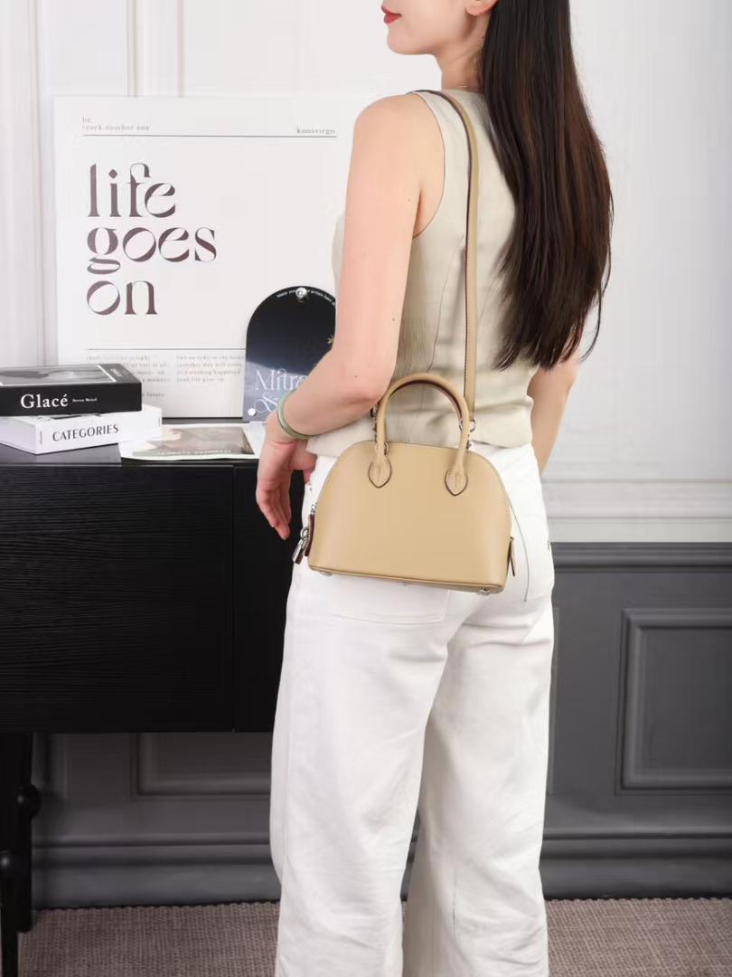 Beige Hermès mini shoulder bag shown from the side