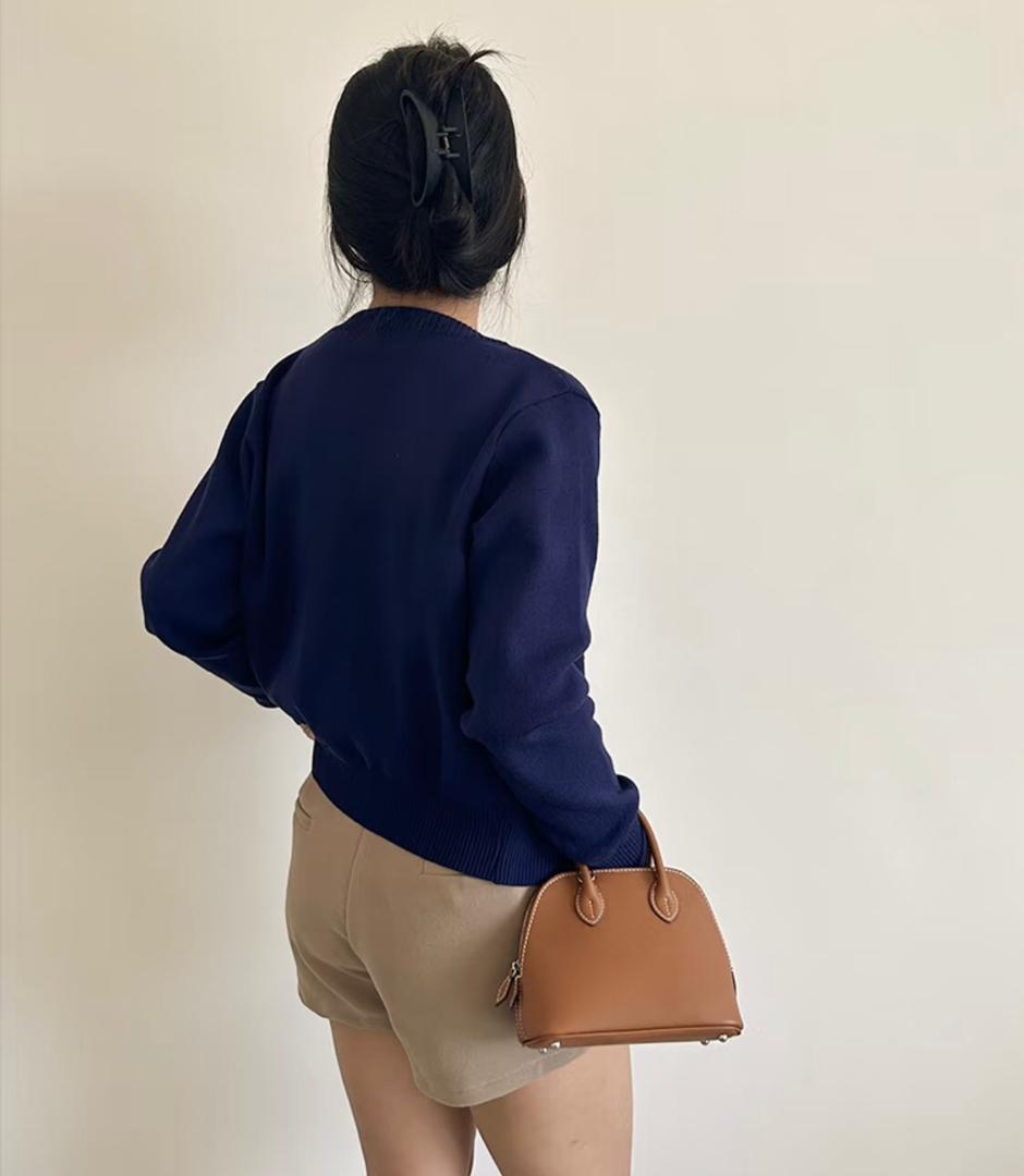 Back view of brown Hermès mini handbag