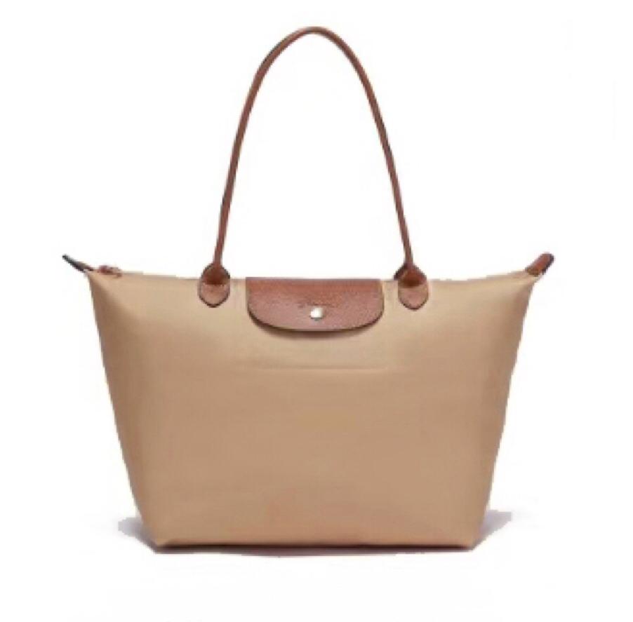 Beige Longchamp women’s tote bag with shoulder handles