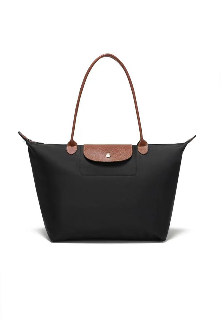 Black Longchamp tote bag with brown shoulder handles