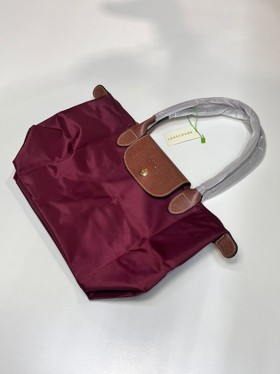 Burgundy Longchamp women’s foldable tote bag