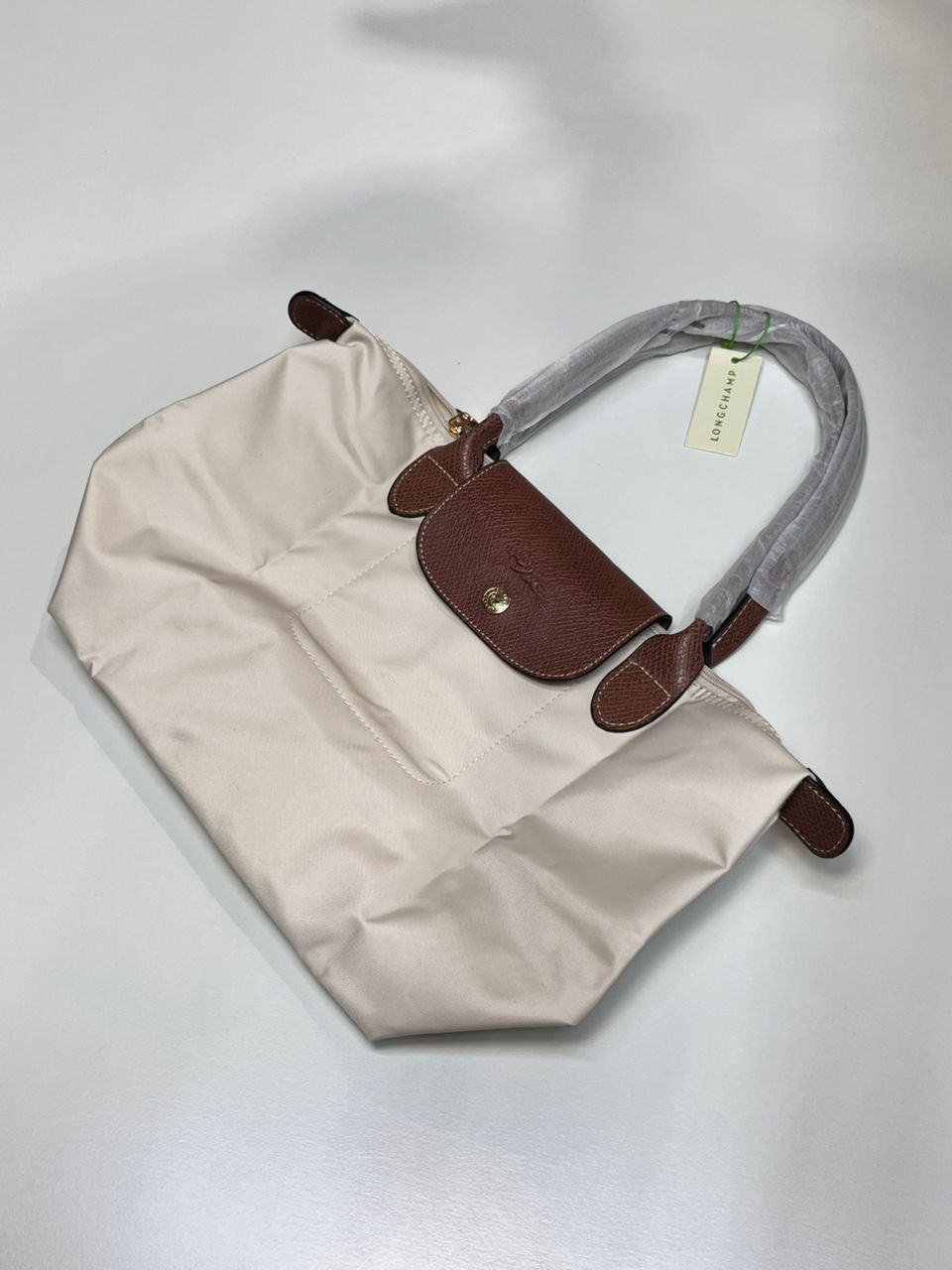 Cream Longchamp women’s foldable tote bag