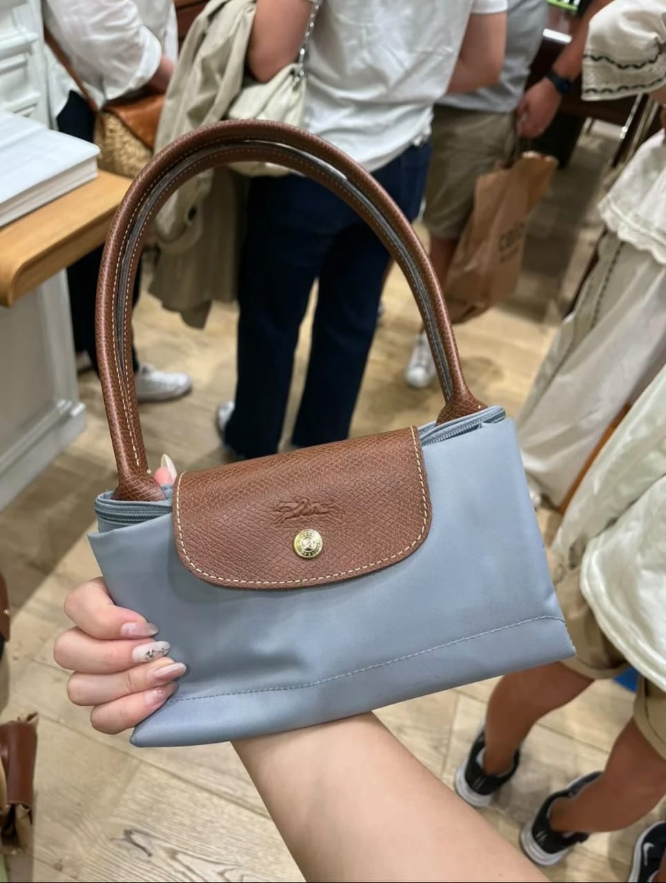 Grey Longchamp women’s foldable tote bag available in UAE