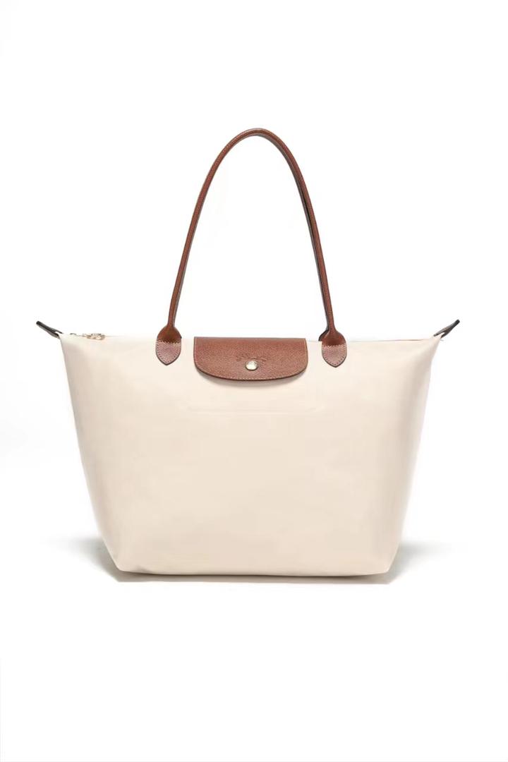 White Longchamp tote bag with brown handles
