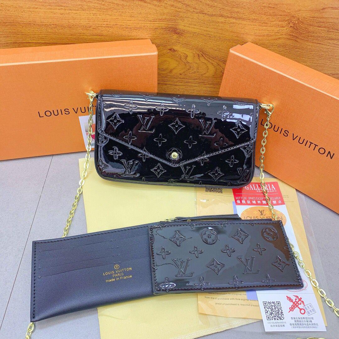 Black Louis Vuitton women’s chain bag with accessories
