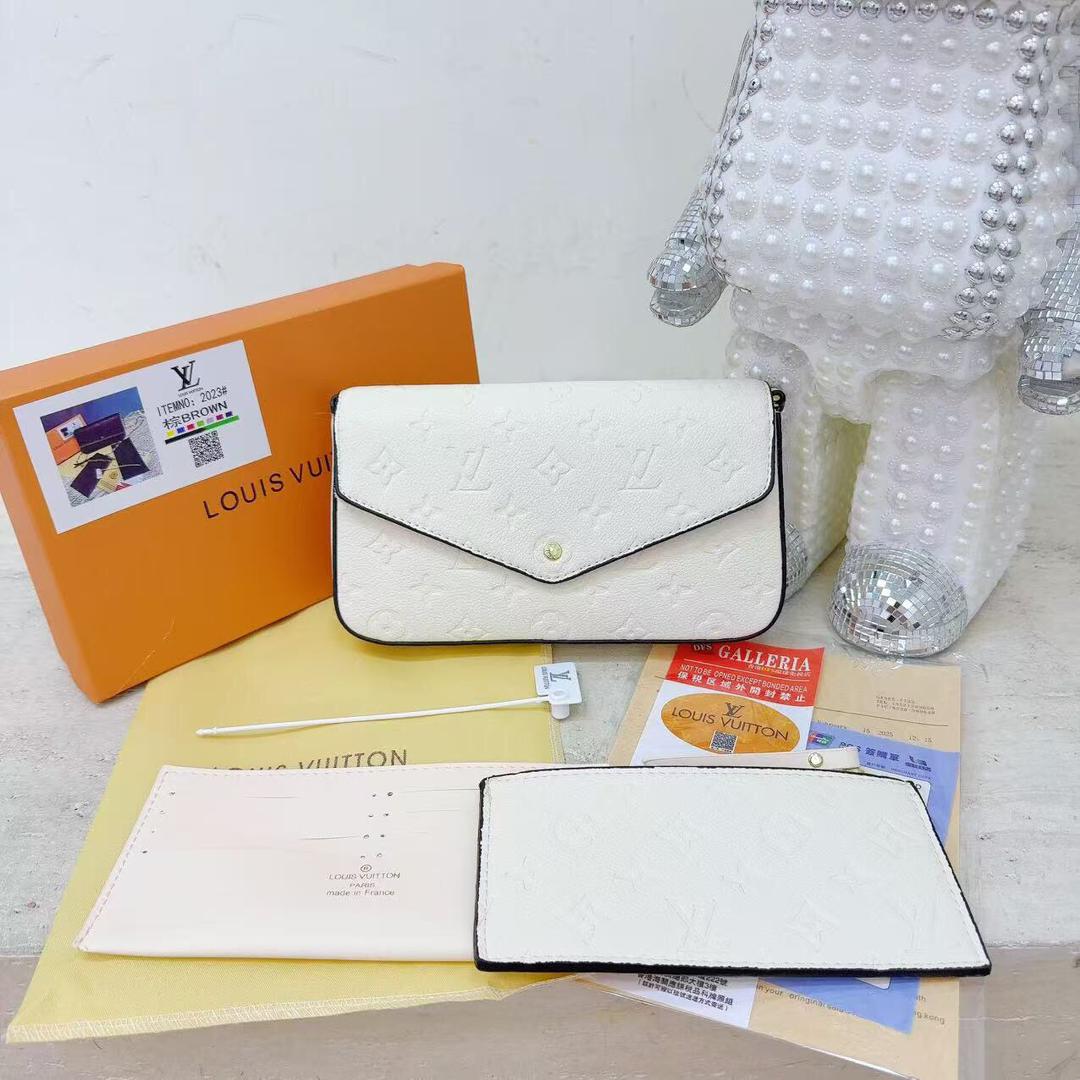 White women’s chain bag displayed with coordinating accessory