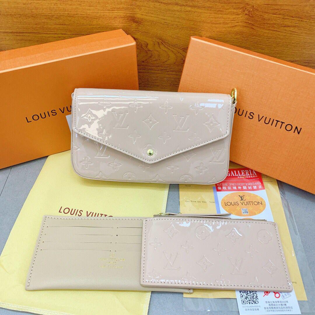 White Louis Vuitton women’s compact chain bag
