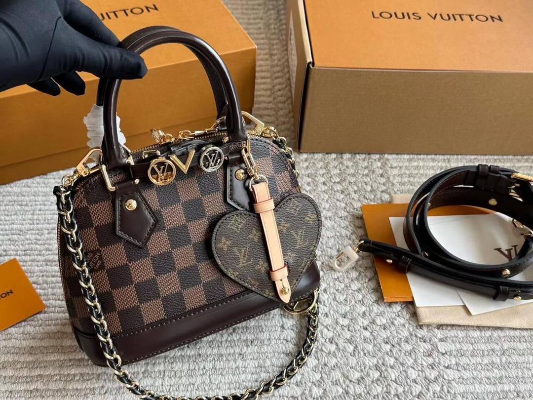 Brown women’s mini handbag shown by its top handles