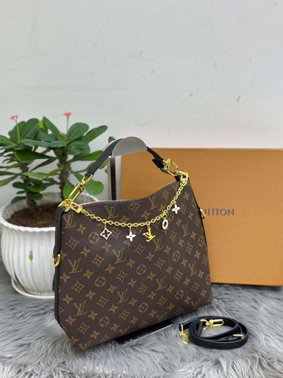 Louis Vuitton monogram canvas hobo bag with black leather handle and shoulder strap
