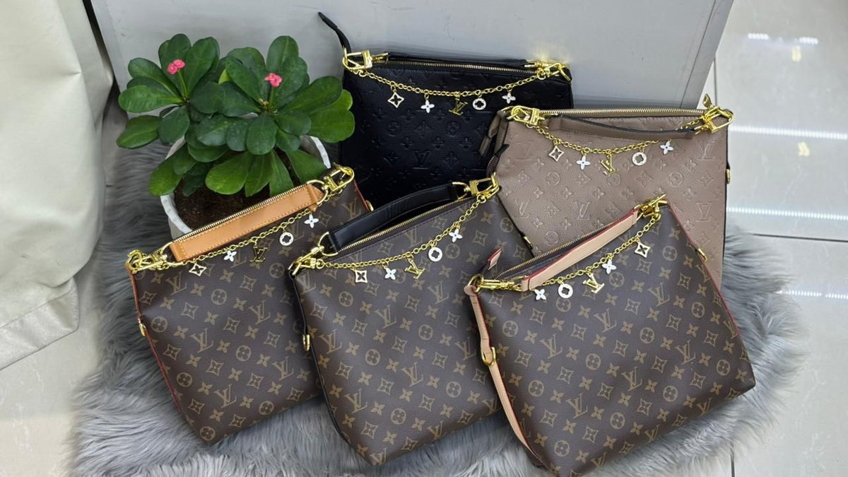 Louis Vuitton monogram leather hobo shoulder bags with gold charm chain collection