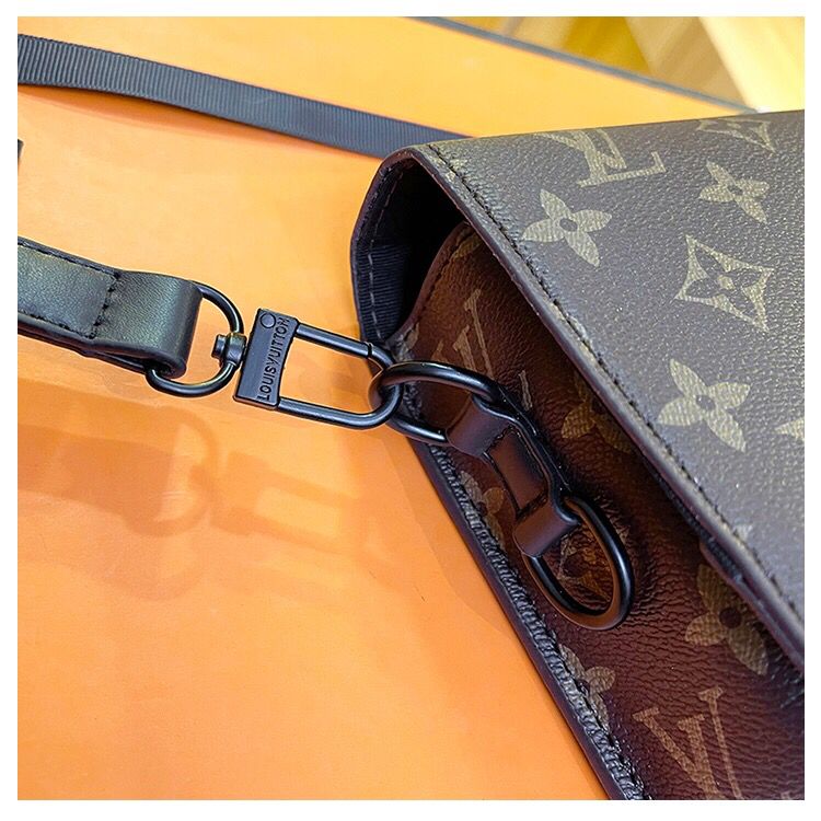 Louis Vuitton style monogram bag strap and hardware detail