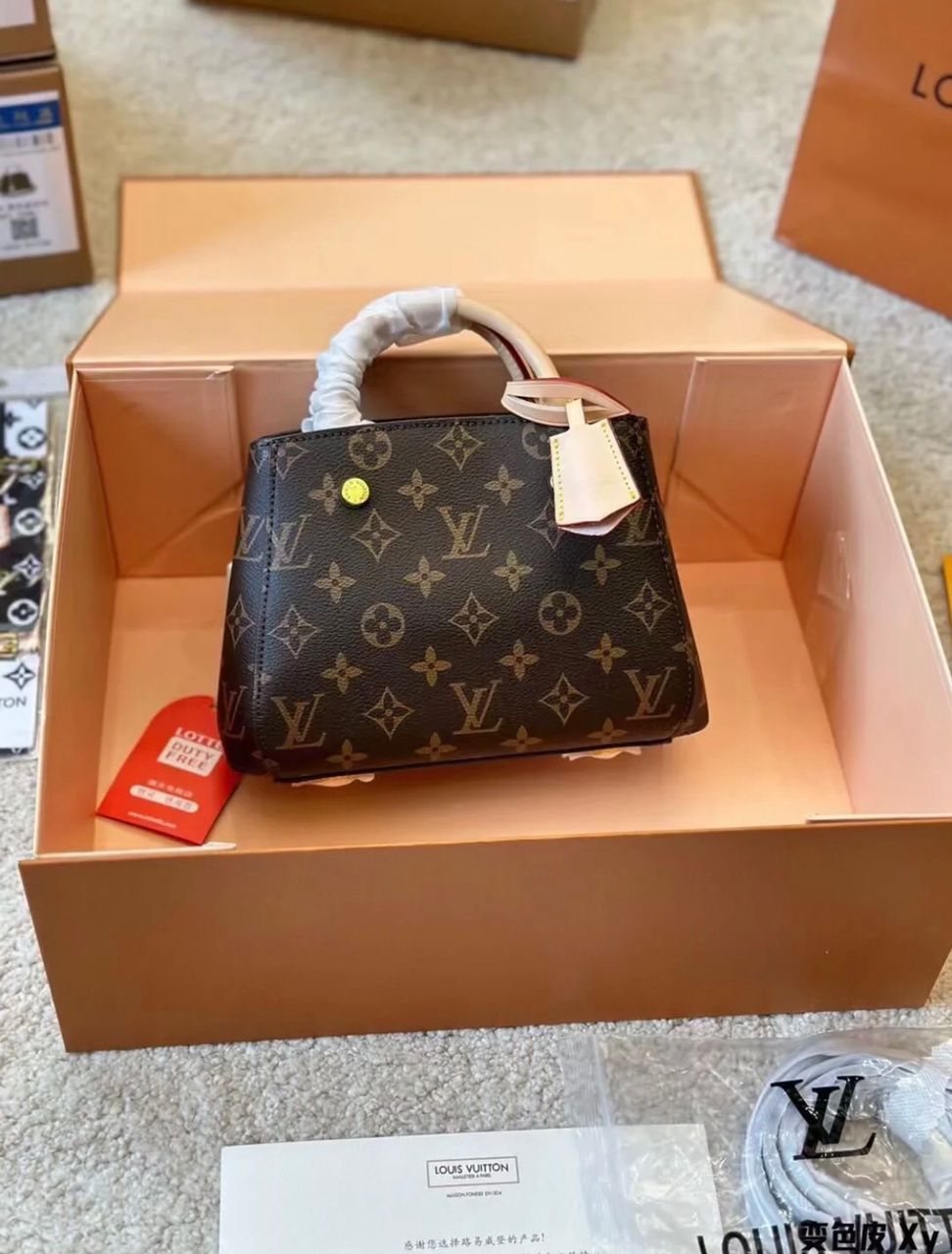 Louis Vuitton style monogram handbag displayed in a presentation box